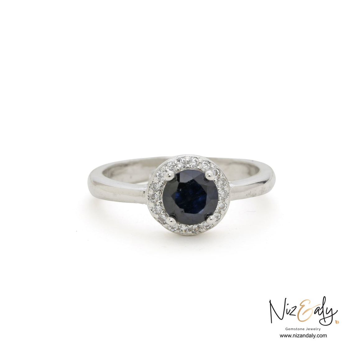 Niz & Aly sterling silver ring featuring a round blue sapphire center stone surrounded by a halo of white accents