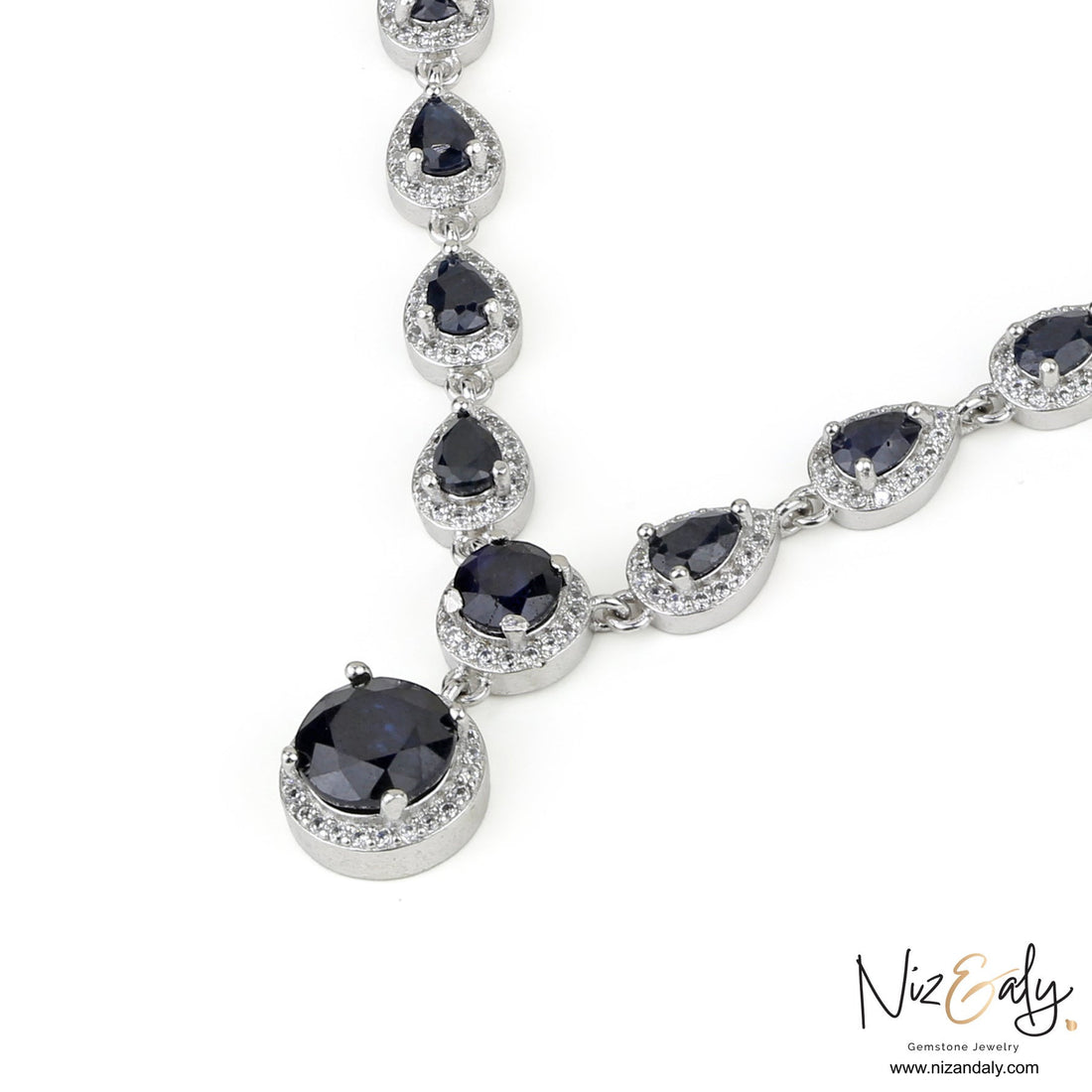 Niz & Aly blue sapphire and sterling silver necklace featuring teardrop and round cut stones with white accents
