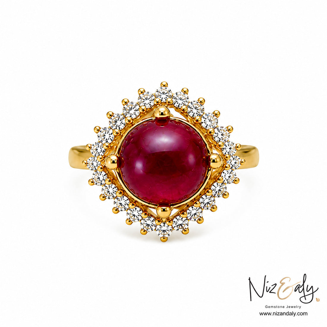 Niz & Aly cabochon ruby ring with a diamond halo set in polished yellow gold, showcasing a deep crimson gemstone.