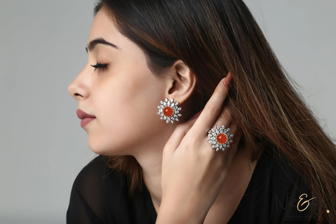 Niz & Aly faceted carnelian and quartz flower-shaped earrings and ring set worn by a woman in profile