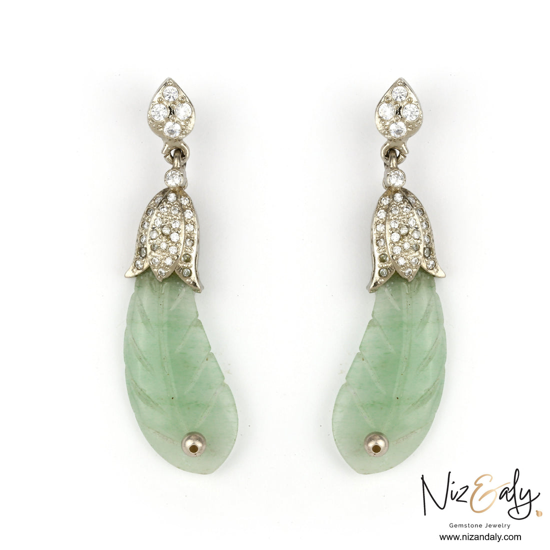 Niz & Aly carved prehnite leaf-shaped drop earrings with diamond-encrusted silver caps on a white background.