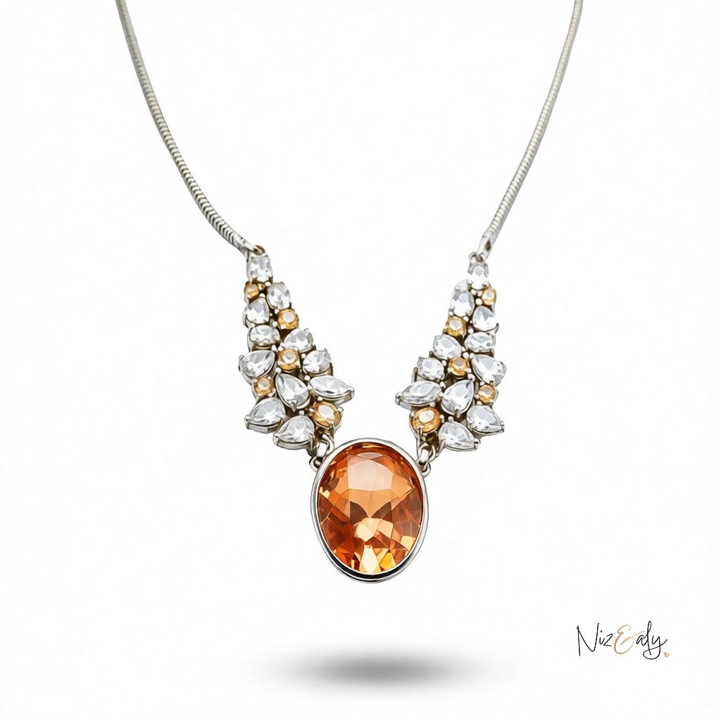 Niz & Aly statement necklace featuring a large oval champagne zirconia pendant with clear crystal accents on a chain