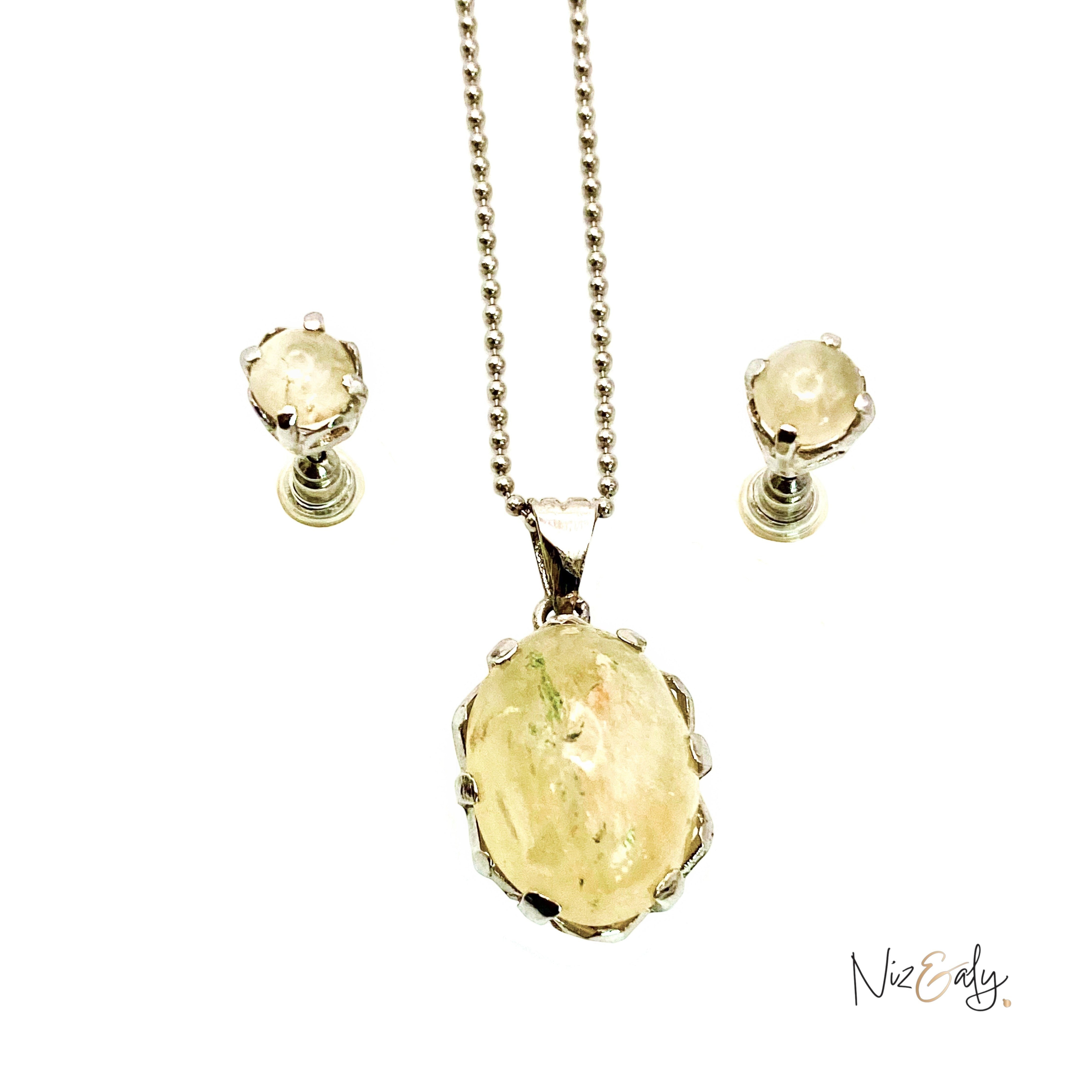 Niz & Aly natural untreated citrine locket pendant on a silver chain with matching stud earrings