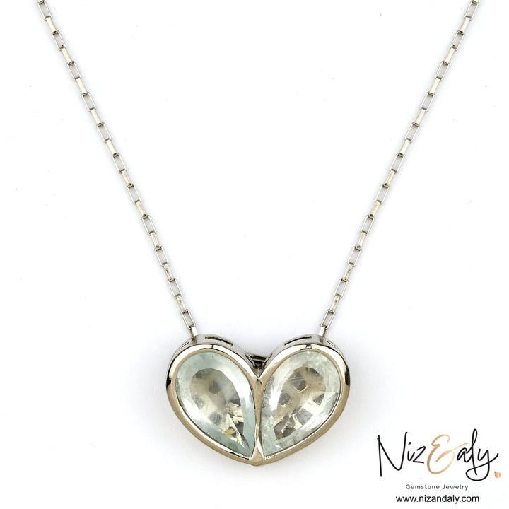 Niz & Aly sterling silver twin heart necklace featuring two clear quartz gemstones on a delicate silver chain.
