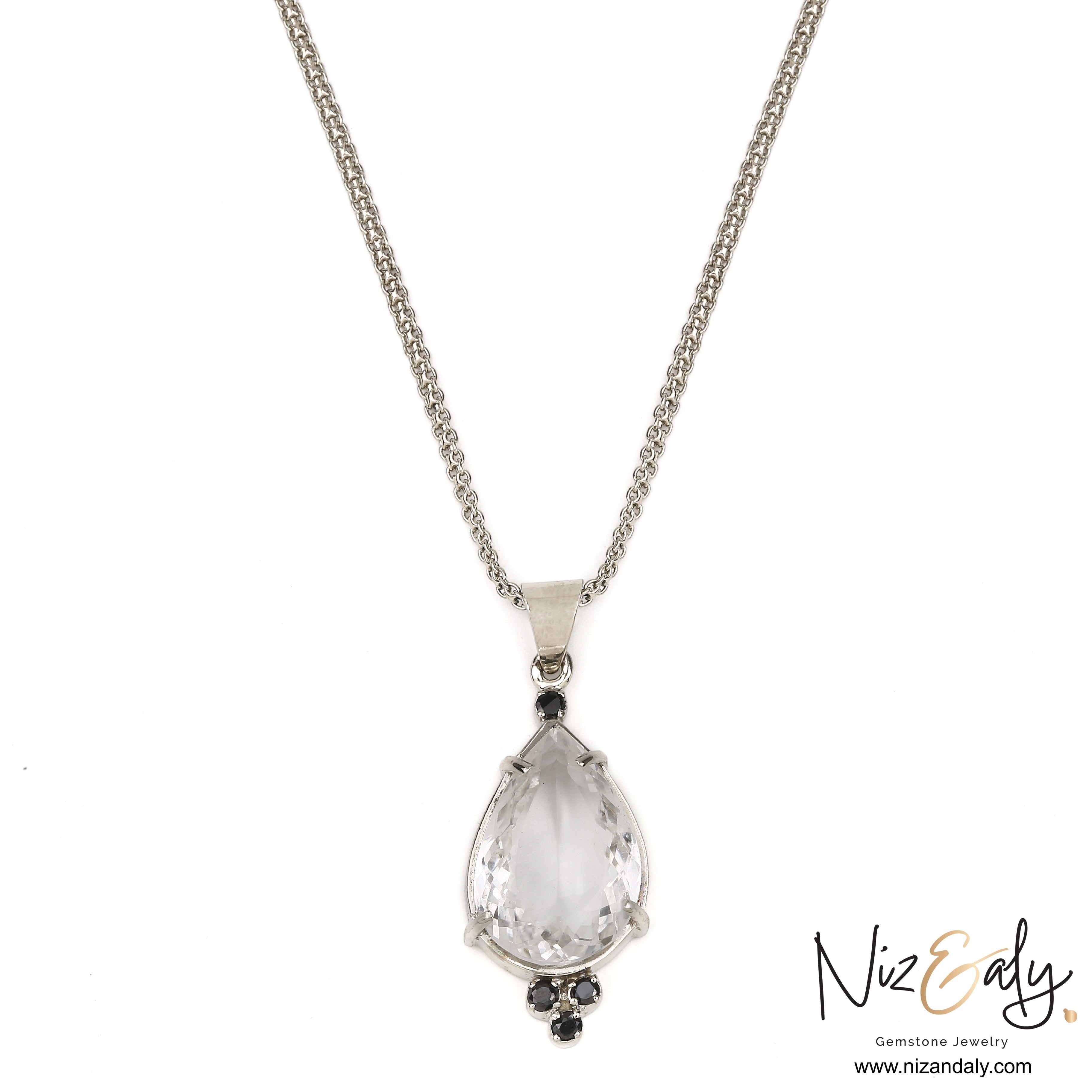 Niz & Aly clear quartz teardrop pendant with black onyx accents on a silver chain