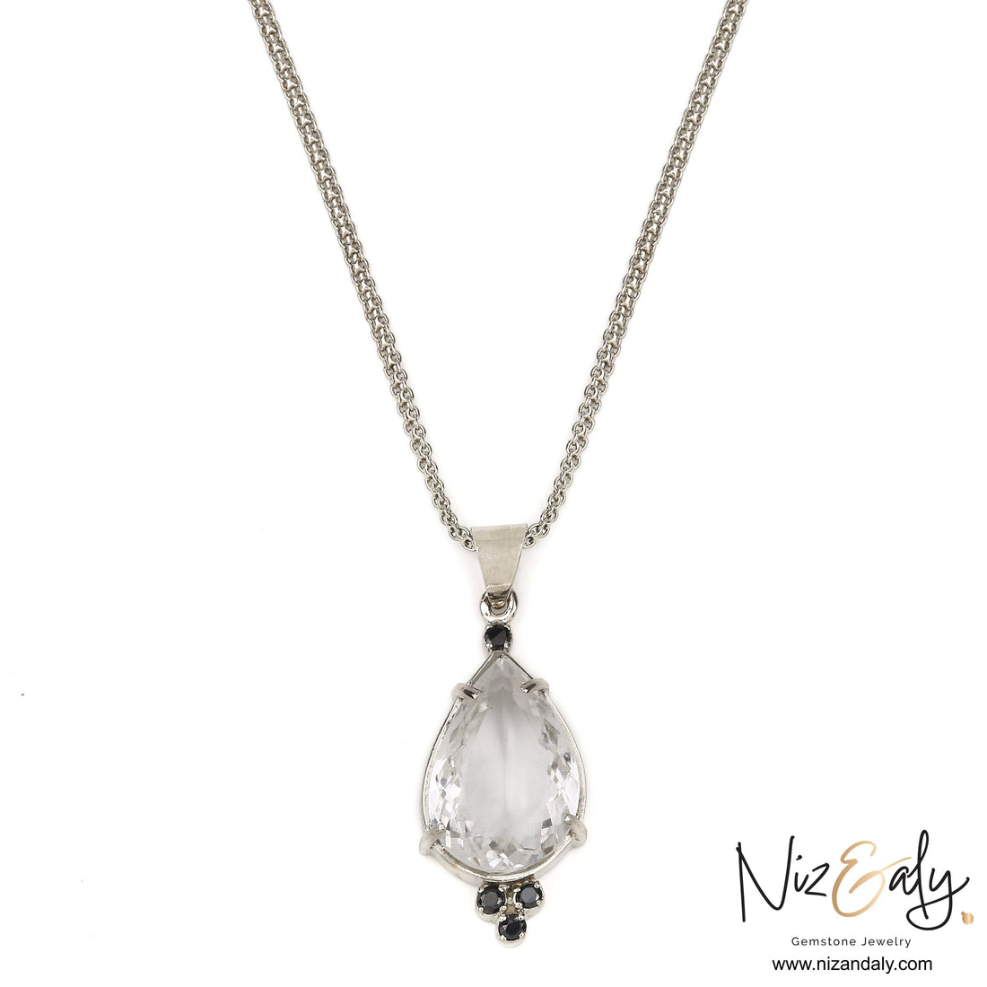 Niz & Aly clear quartz teardrop pendant with black onyx accents on a silver chain
