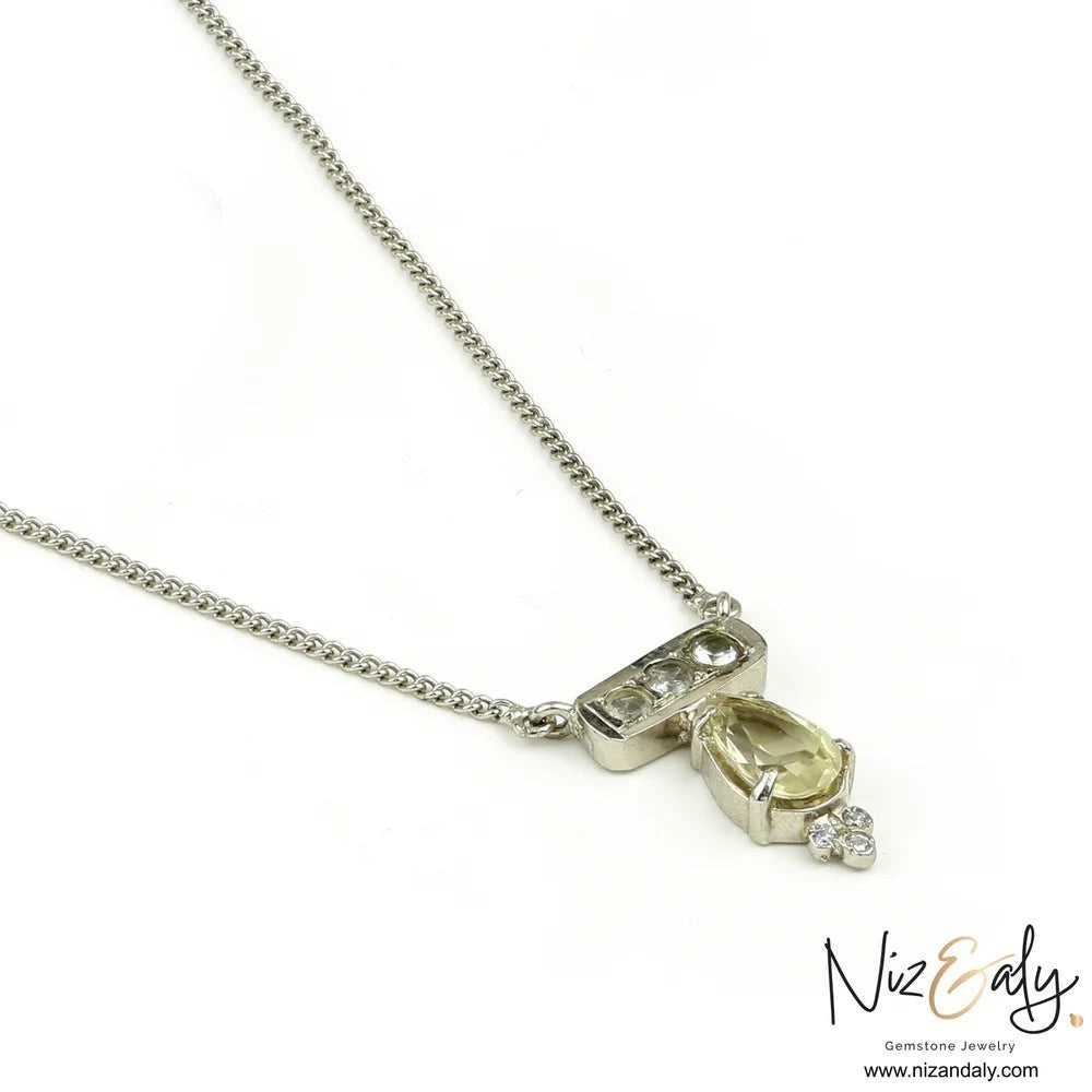 Niz & Aly clear quartz pendant necklace in polished 925 sterling silver with a delicate chain on white background