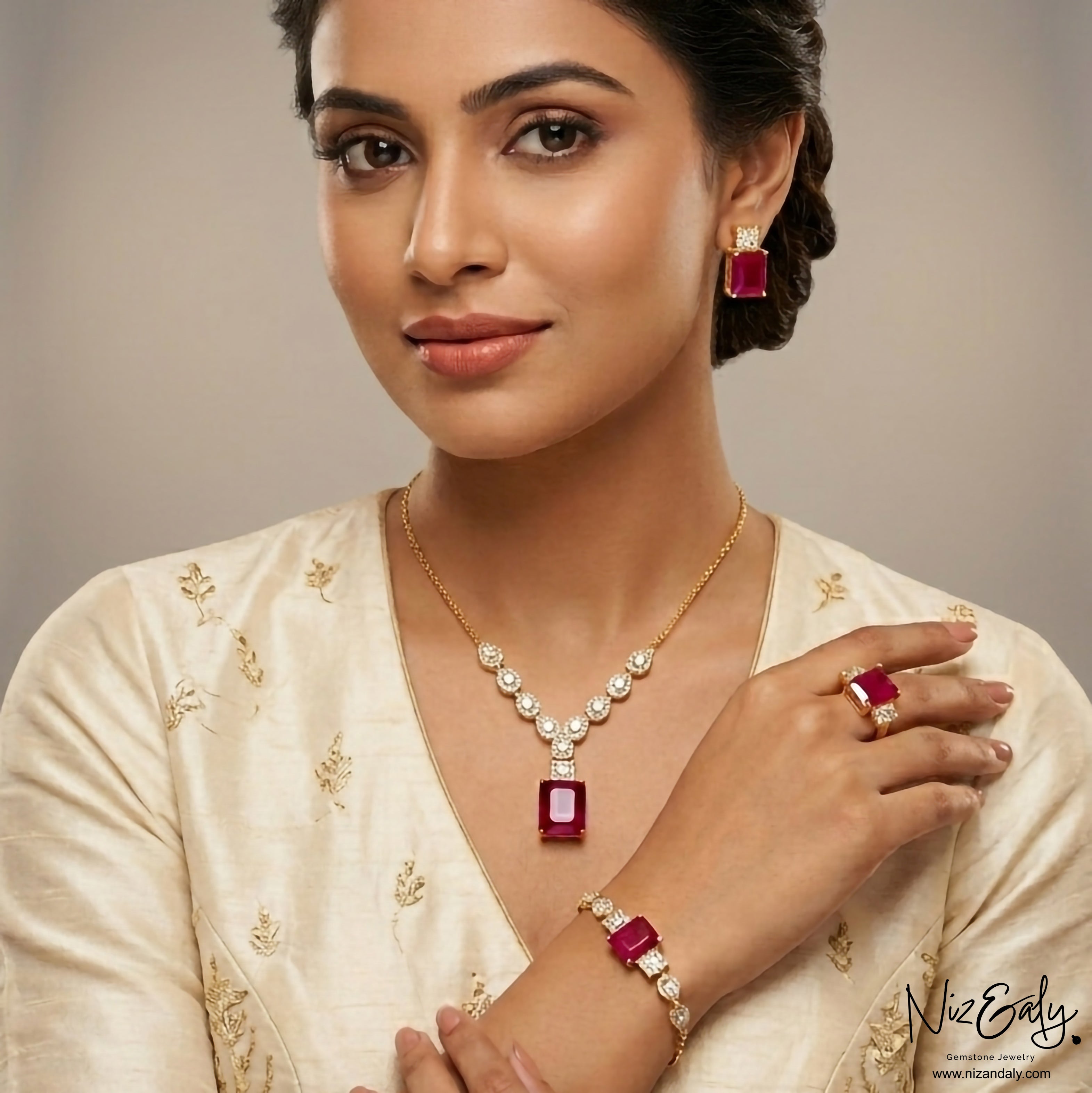 Niz & Aly composite ruby jewelry set featuring a pendant necklace, earrings, bracelet, and ring on a model.