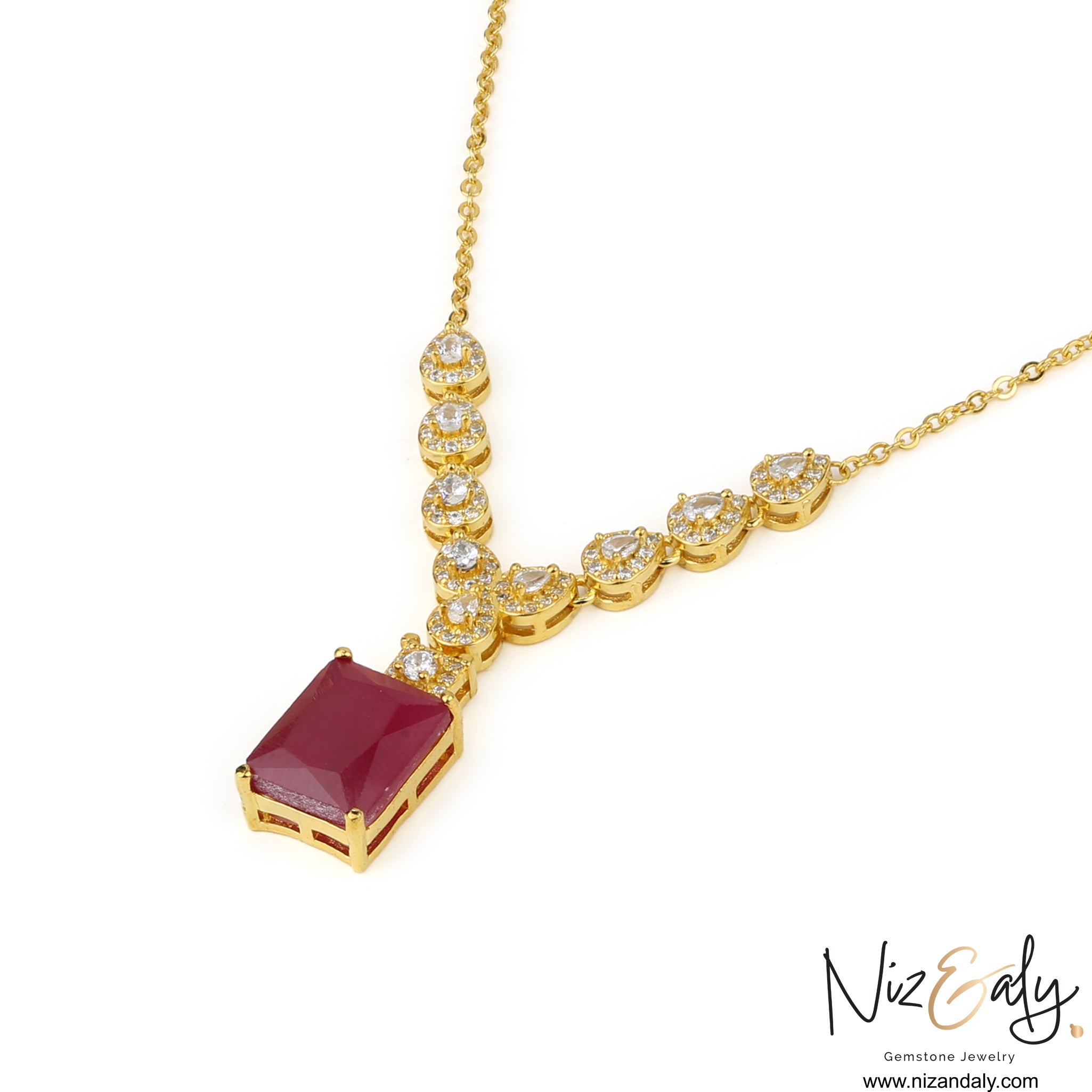 Niz & Aly composite ruby pendant necklace with a rectangular red gemstone, gold setting, and sparkling accent stones.