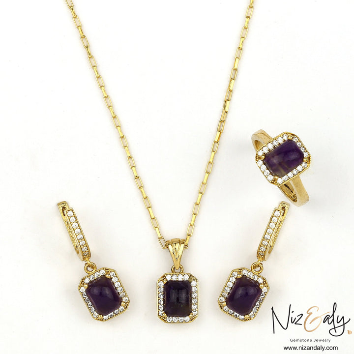 Niz & Aly cushion cut dark amethyst pendant, earrings, and ring set with diamond accents in gold settings.
