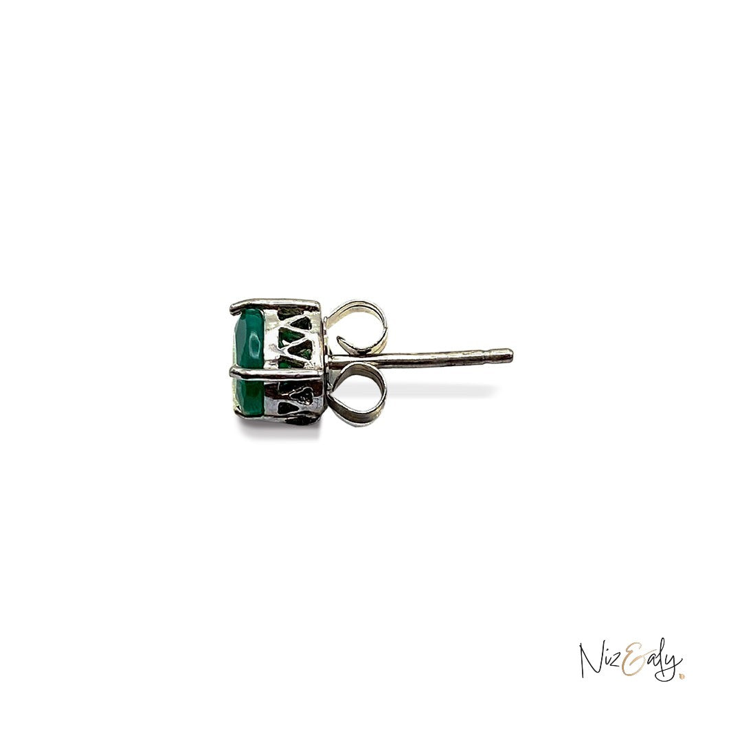 Niz & Aly dainty emerald ear stud in a silver setting, shown from a side profile view.