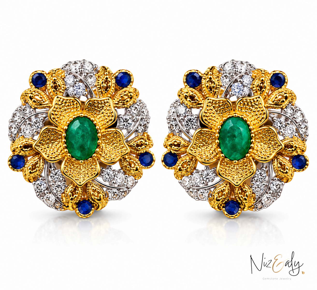 Niz & Aly floral stud earrings featuring a central emerald in a bezel setting, accented with diamonds and sapphires.