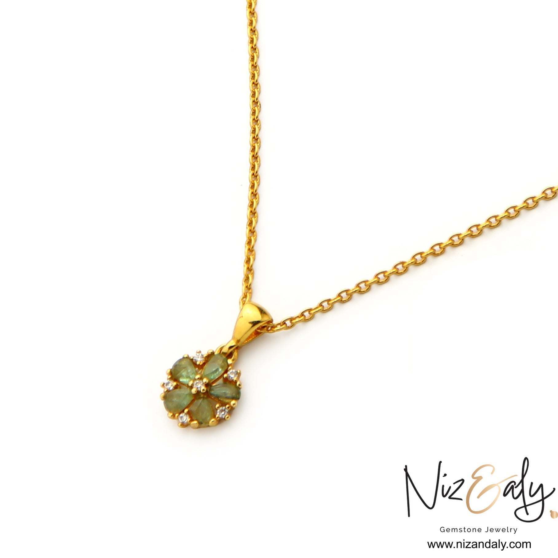 Niz & Aly floral pendant necklace featuring natural emeralds and clear stones on a gold-plated sterling silver chain.