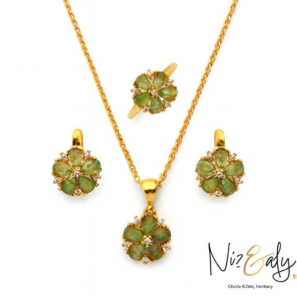 Niz & Aly floral pendant set featuring natural emeralds and clear stones in gold-plated sterling silver.