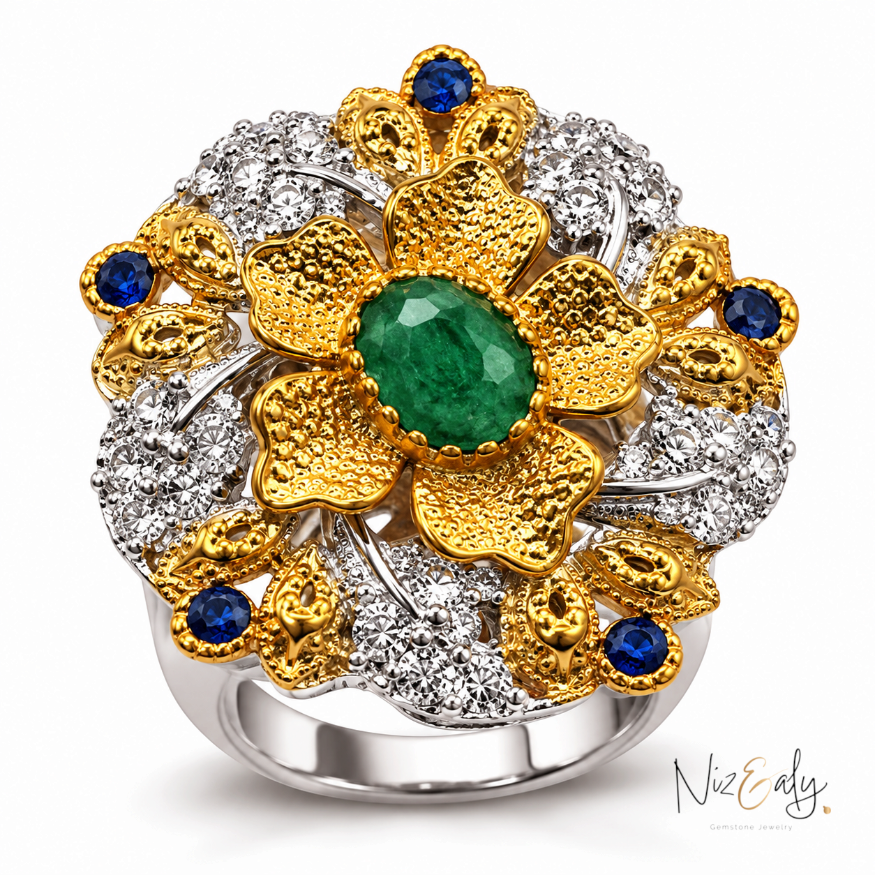 Niz & Aly floral statement ring featuring a central emerald in a bezel setting with gold petals and diamond accents.