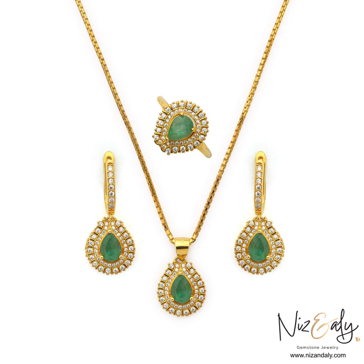 Niz & Aly Emerald Reverie teardrop pendant, earrings, and ring set in gold-plated sterling silver with clear halos.