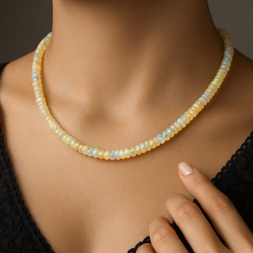 Niz & Aly 18-inch Ethiopian fire opal rondelle bead necklace with iridescent flashes worn on a model