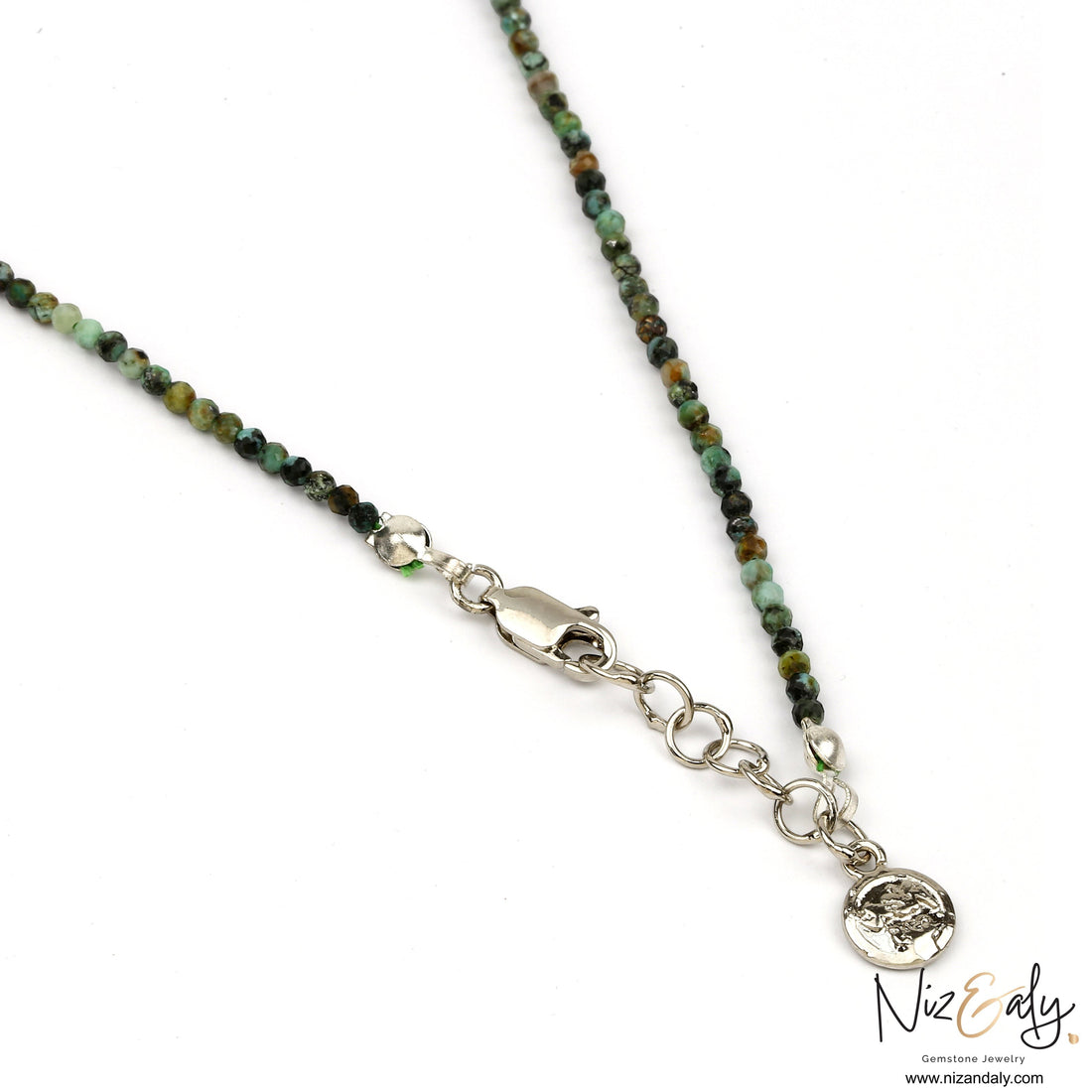 Niz & Aly dainty faceted African turquoise beaded necklace with silver clasp and charm detail on white background