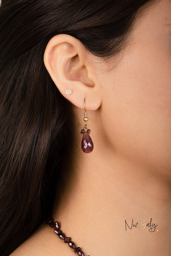 Niz & Aly Mozambique Almandine garnet and ruby drop earring worn on a model with matching garnet necklace