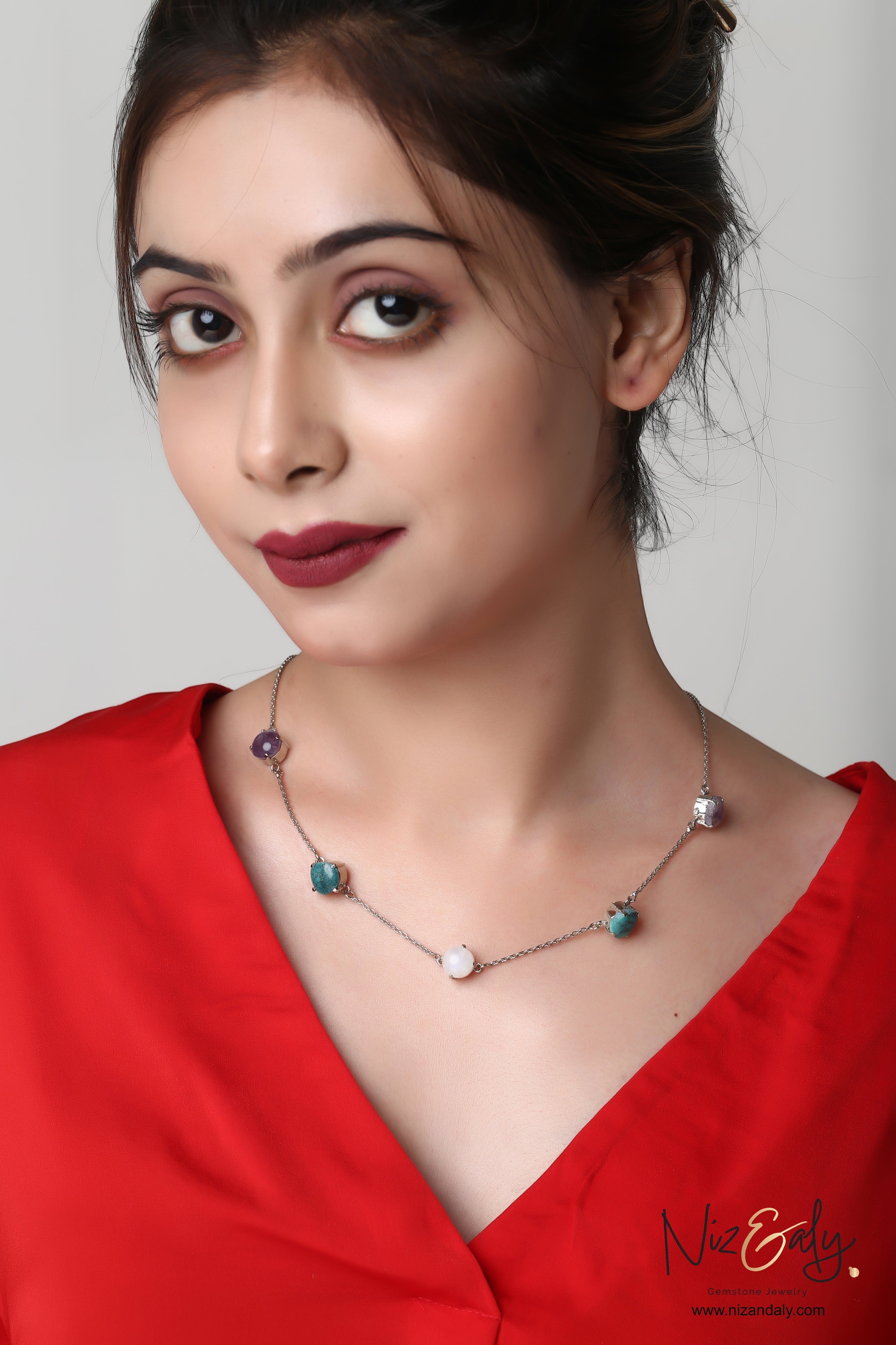 Niz & Aly necklace featuring amethyst, turquoise, and milky quartz stones on a delicate sterling silver chain.