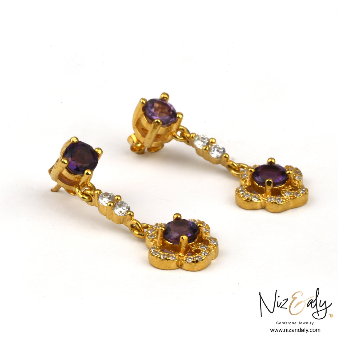Niz & Aly gold plated drop earrings featuring faceted purple amethyst gemstones and sparkling white accent stones.