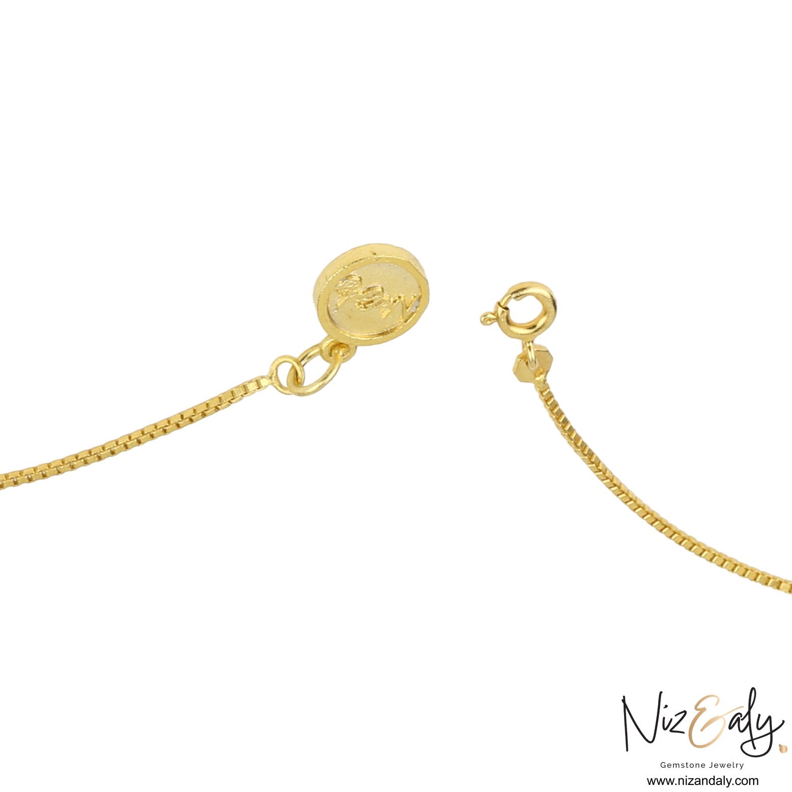 Niz & Aly gold box chain necklace clasp with a round branded tag and spring ring closure