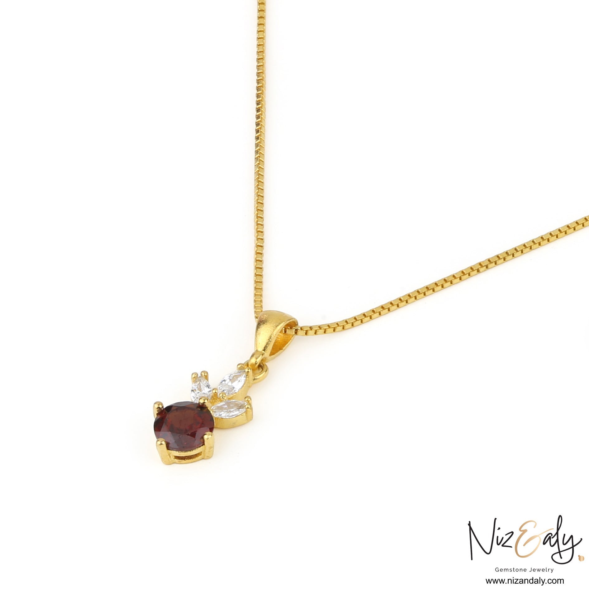 Niz & Aly gold necklace featuring a round natural garnet gemstone accented with small marquise-cut white crystals.