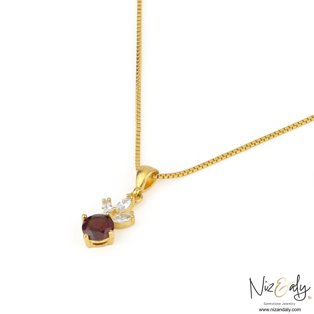 Niz & Aly gold necklace featuring a round natural garnet gemstone accented with small marquise-cut white crystals.