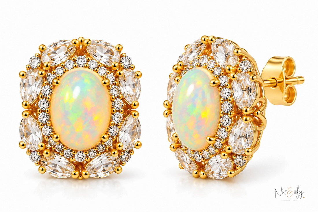 Niz & Aly gold stud earrings featuring a central oval opal surrounded by marquise-cut clear quartz and small crystals.
