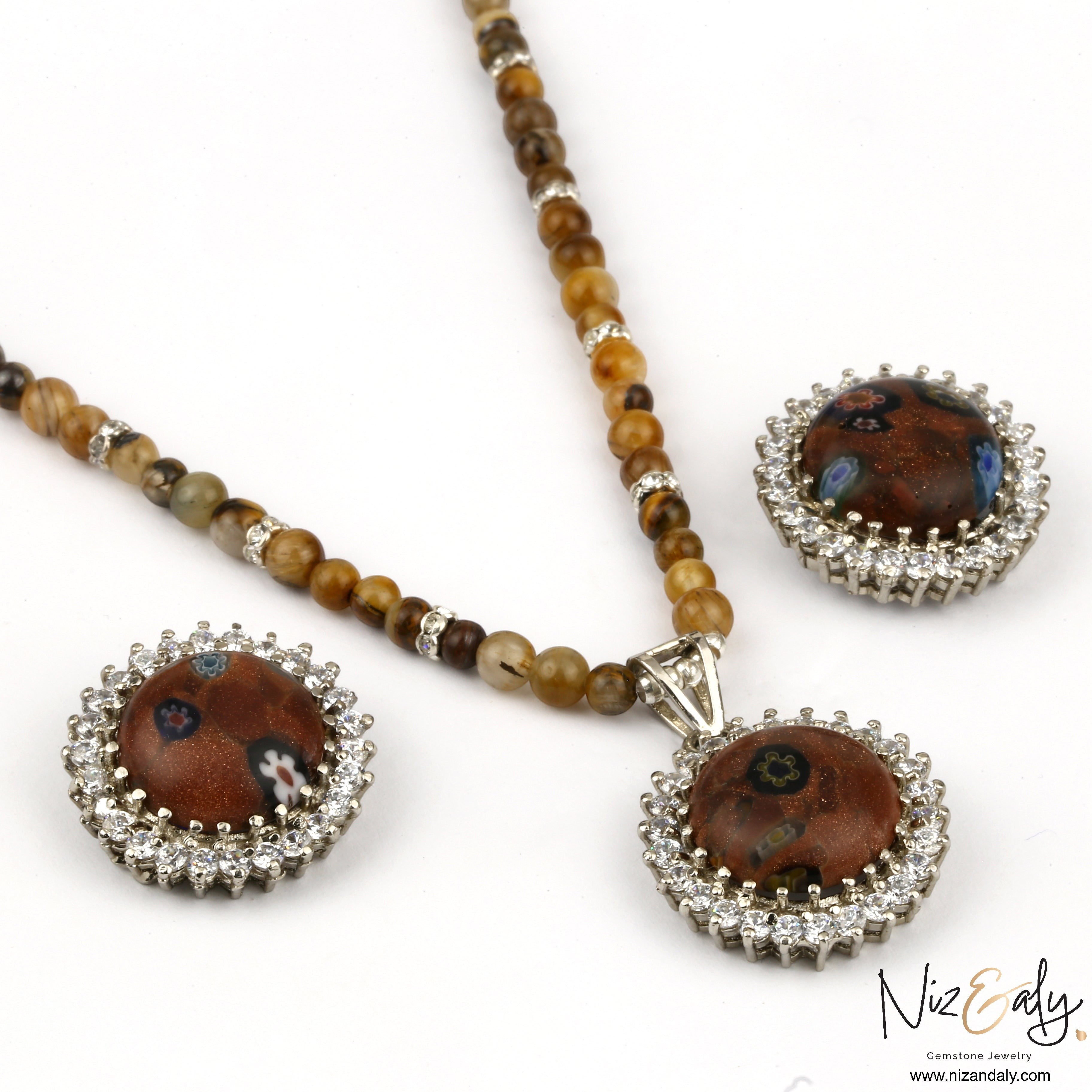 Niz & Aly gold orgonite pendant necklace and earring set with brown tiger's eye beads and sparkling crystal accents.