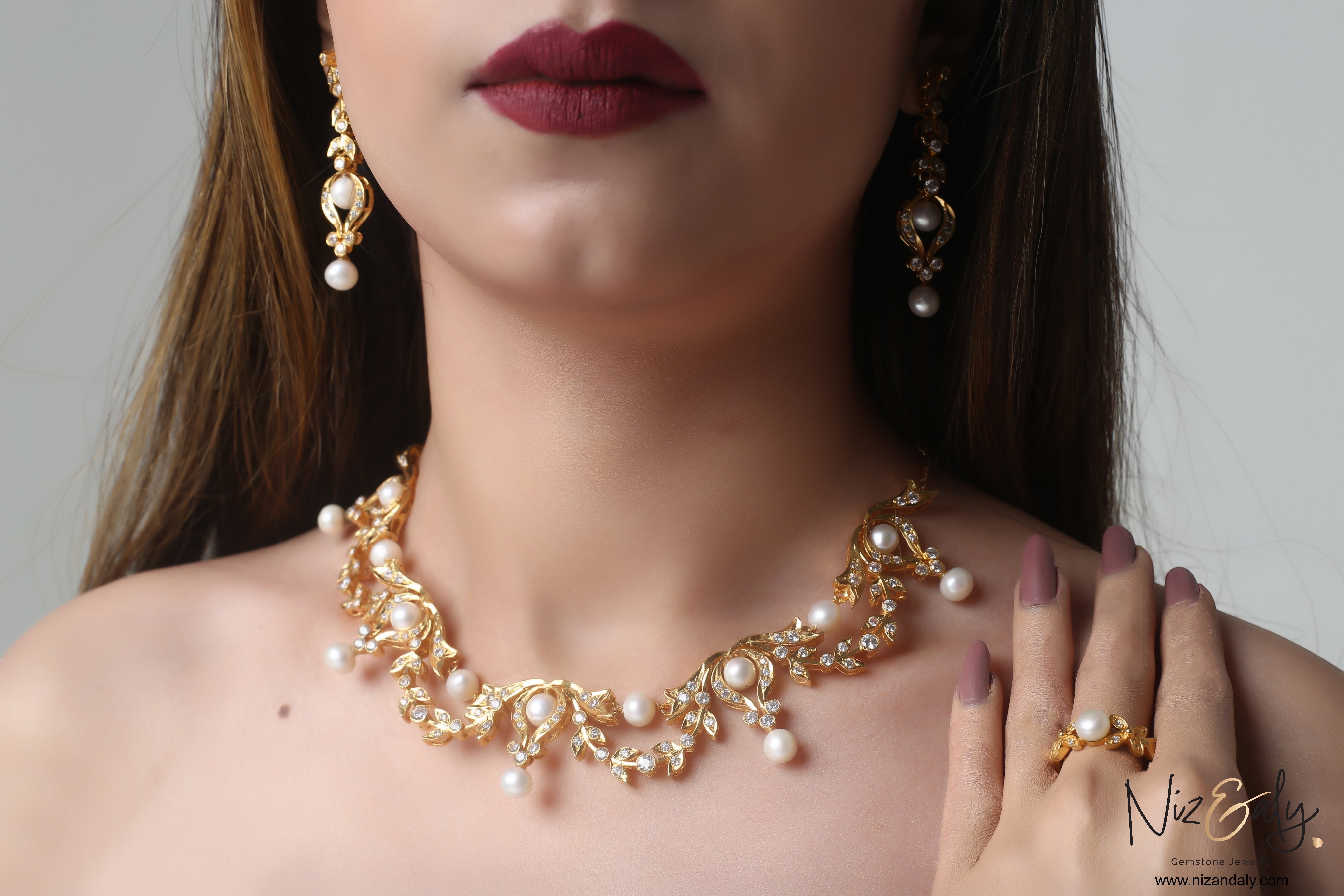 Niz & Aly gold-plated sterling silver bridal necklace set with freshwater pearls and intricate leaf detailing