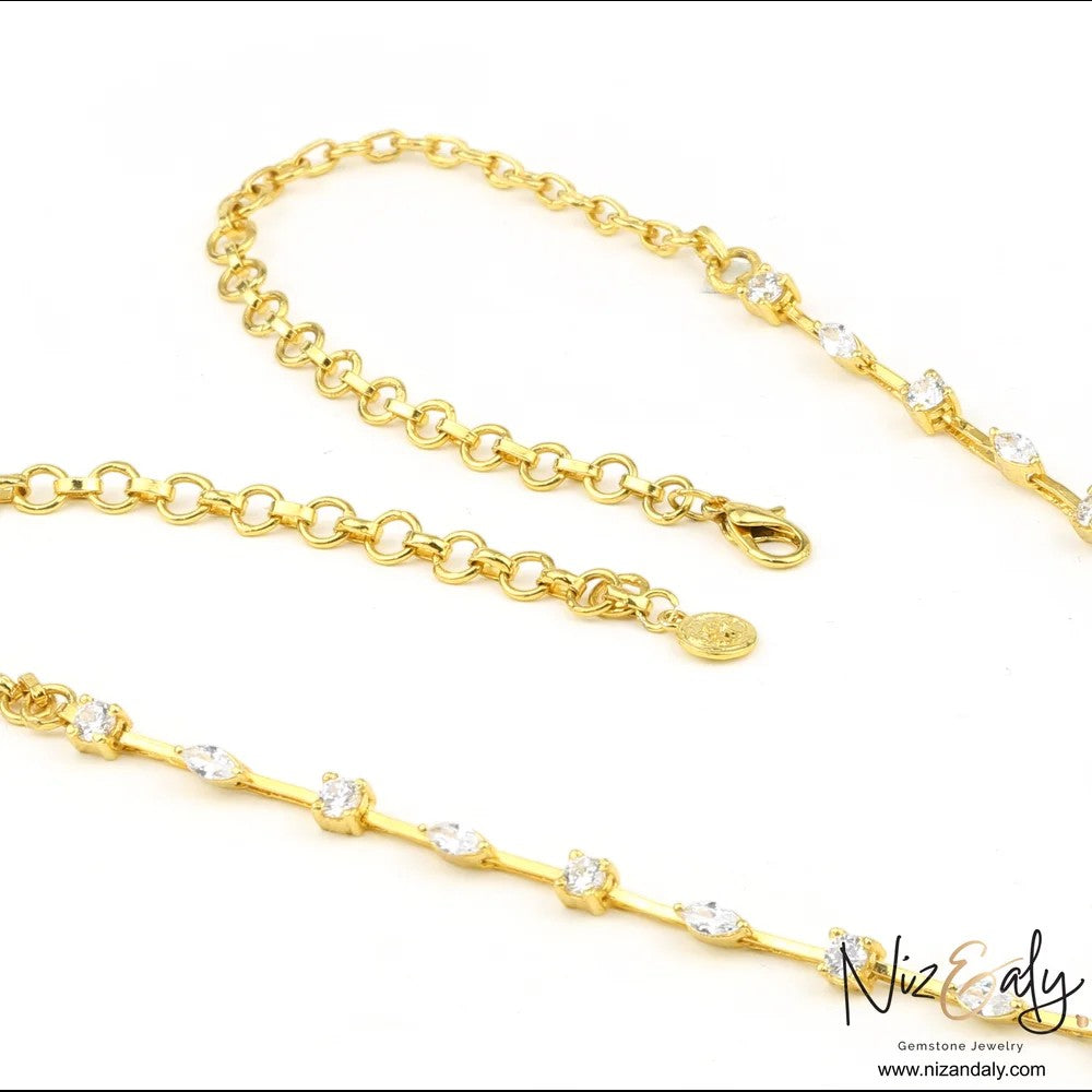 Niz & Aly gold-toned chain necklace featuring marquise-cut clear stones set along the delicate link design