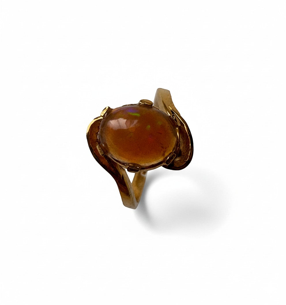 Niz & Aly adjustable ring featuring a luminous golden fire opal set in gold-plated sterling silver.