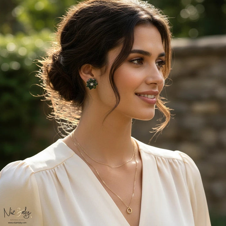 Niz & Aly green chrysoprase flower ear studs worn by a woman with a soft updo and cream blouse