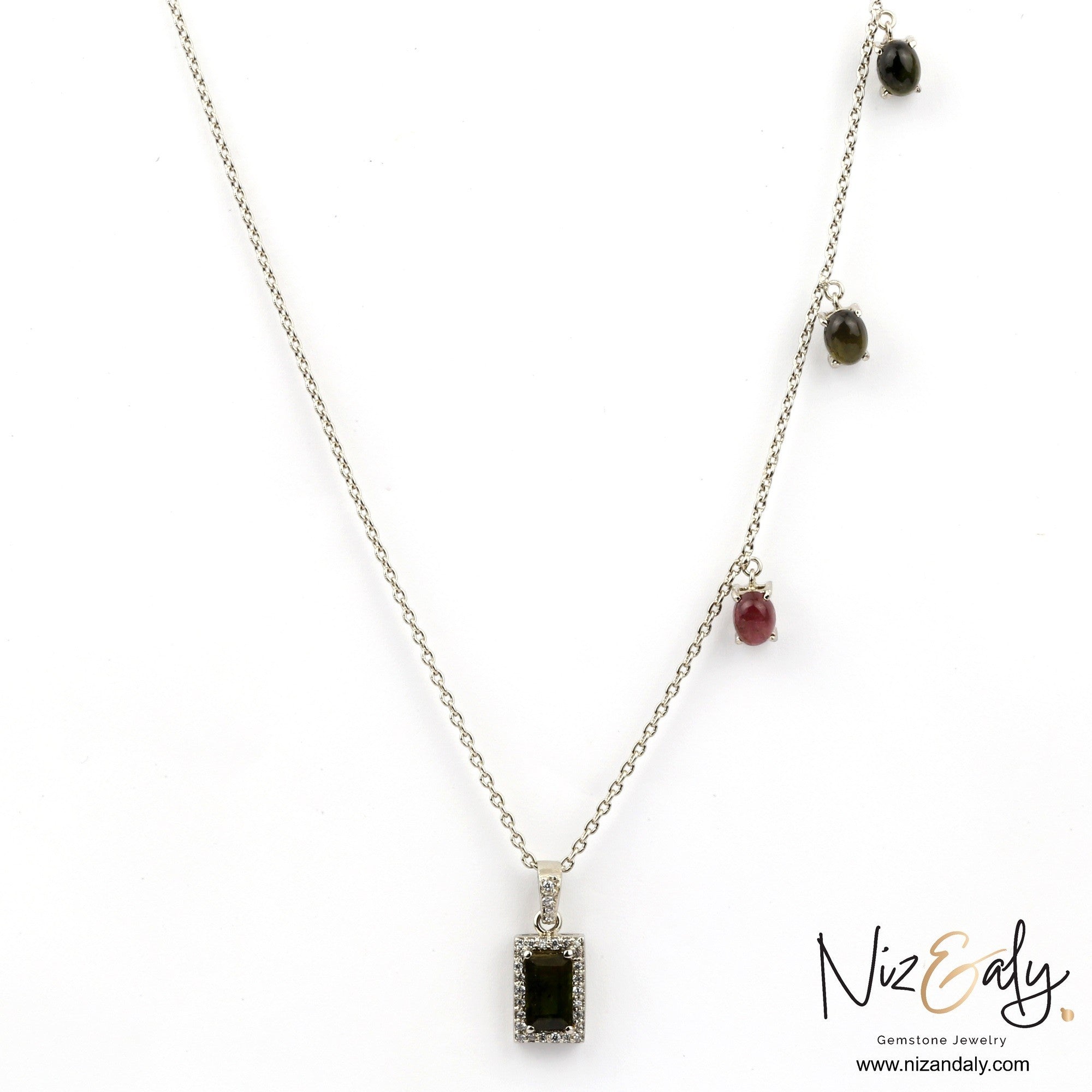 Niz & Aly green tourmaline pendant necklace with a rectangular gemstone and small multi-colored stone accents