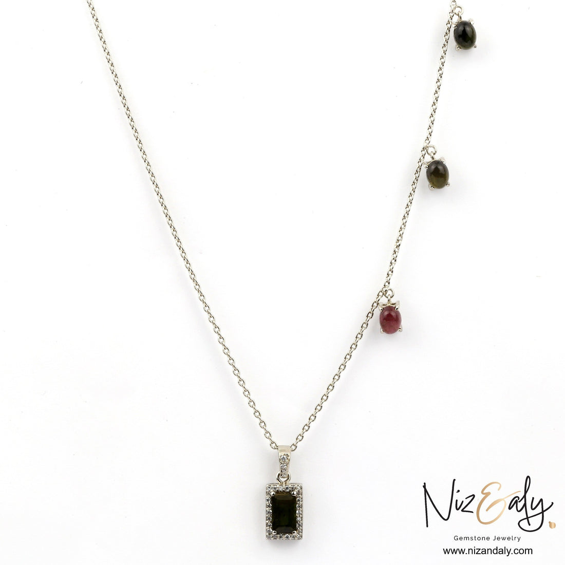 Niz & Aly green tourmaline pendant necklace with a rectangular gemstone and small multi-colored stone accents