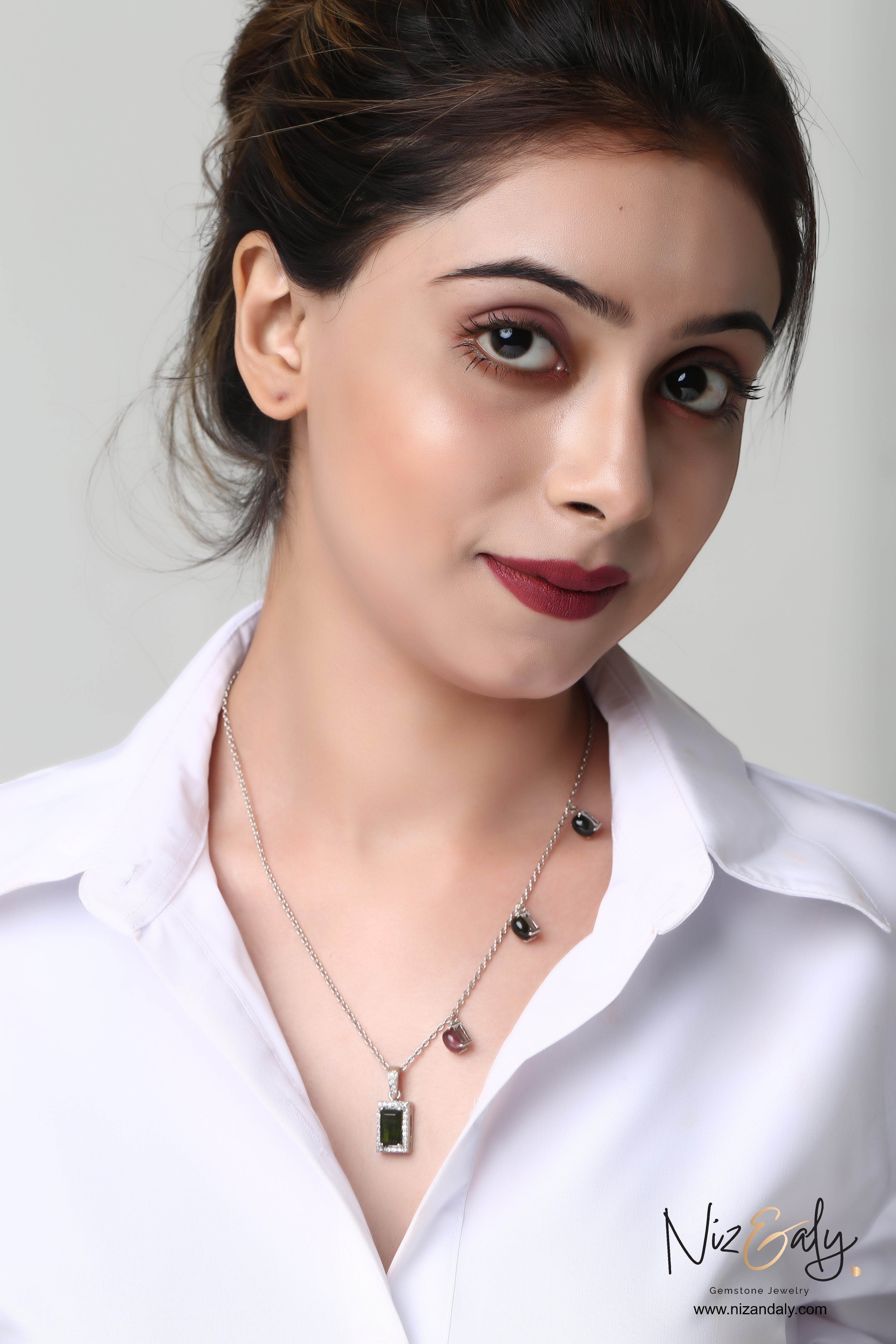 Niz & Aly green tourmaline rectangular pendant necklace with accent gemstones on a delicate silver chain