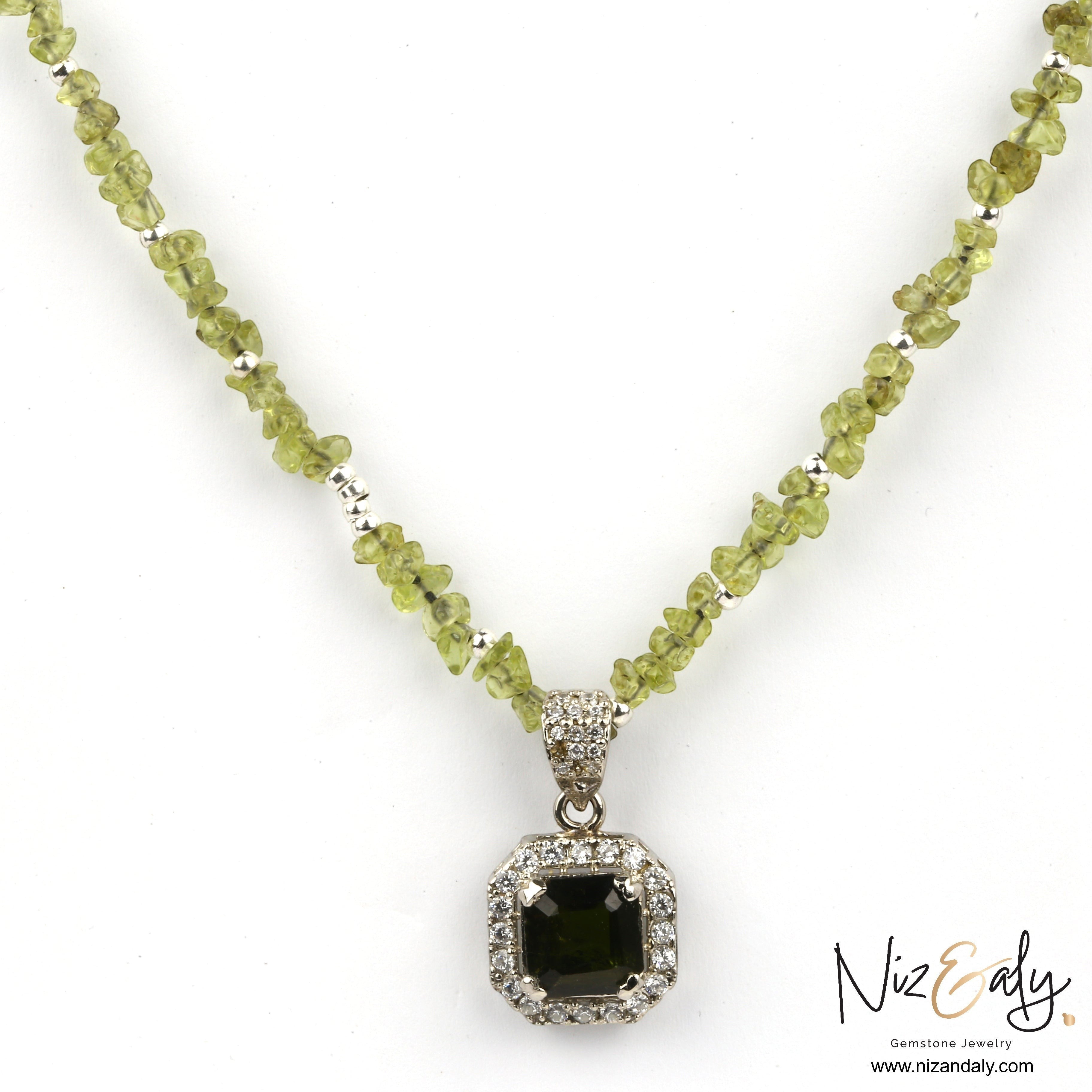 Niz & Aly green tourmaline pendant necklace with a sparkling peridot gemstone chain and diamond halo setting.
