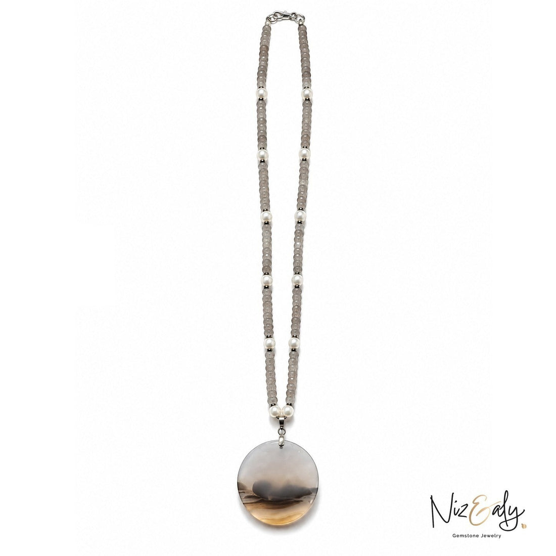 Niz & Aly necklace featuring grey gemstone beads with white pearl accents and a large round polished stone pendant.