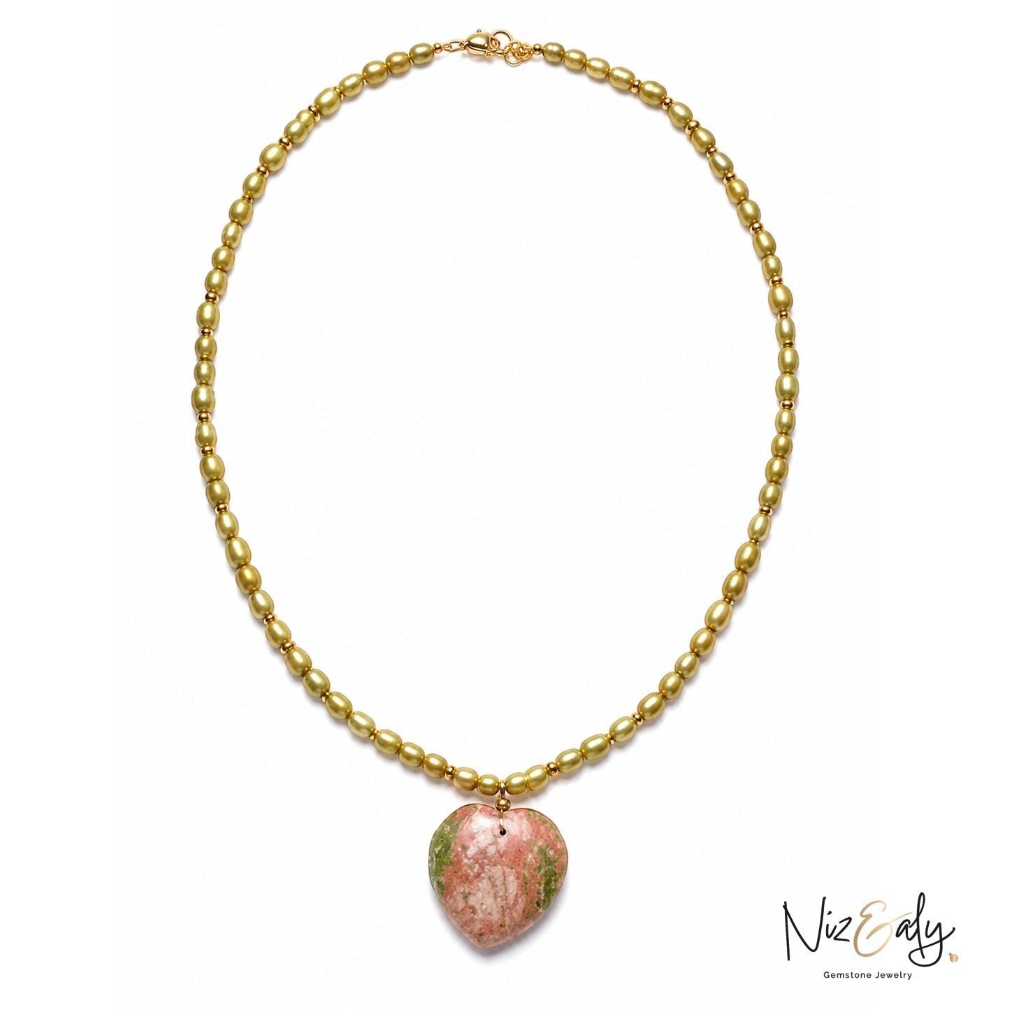 Niz & Aly necklace featuring olive green beads and a heart-shaped pink and green semi-precious gemstone pendant.
