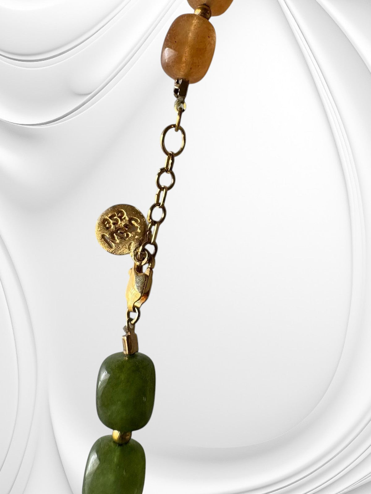 Niz & Aly multicolored rectangular jade quartz necklace featuring gold-tone chain and branded charm detail