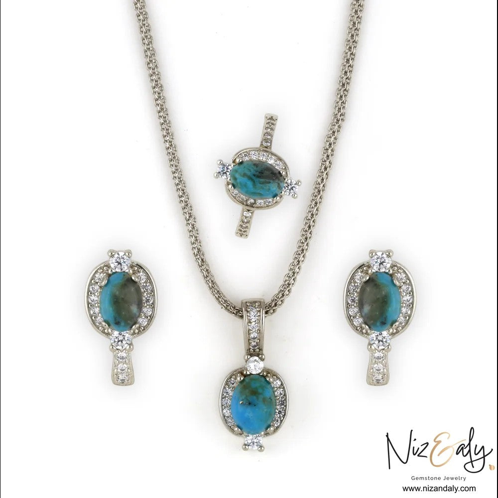 Niz & Aly oval Kingman blue turquoise pendant, ring, and earring set in 925 sterling silver with white accent stones.