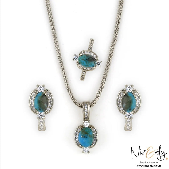 Niz & Aly oval Kingman blue turquoise pendant, ring, and earring set in 925 sterling silver with white accent stones.
