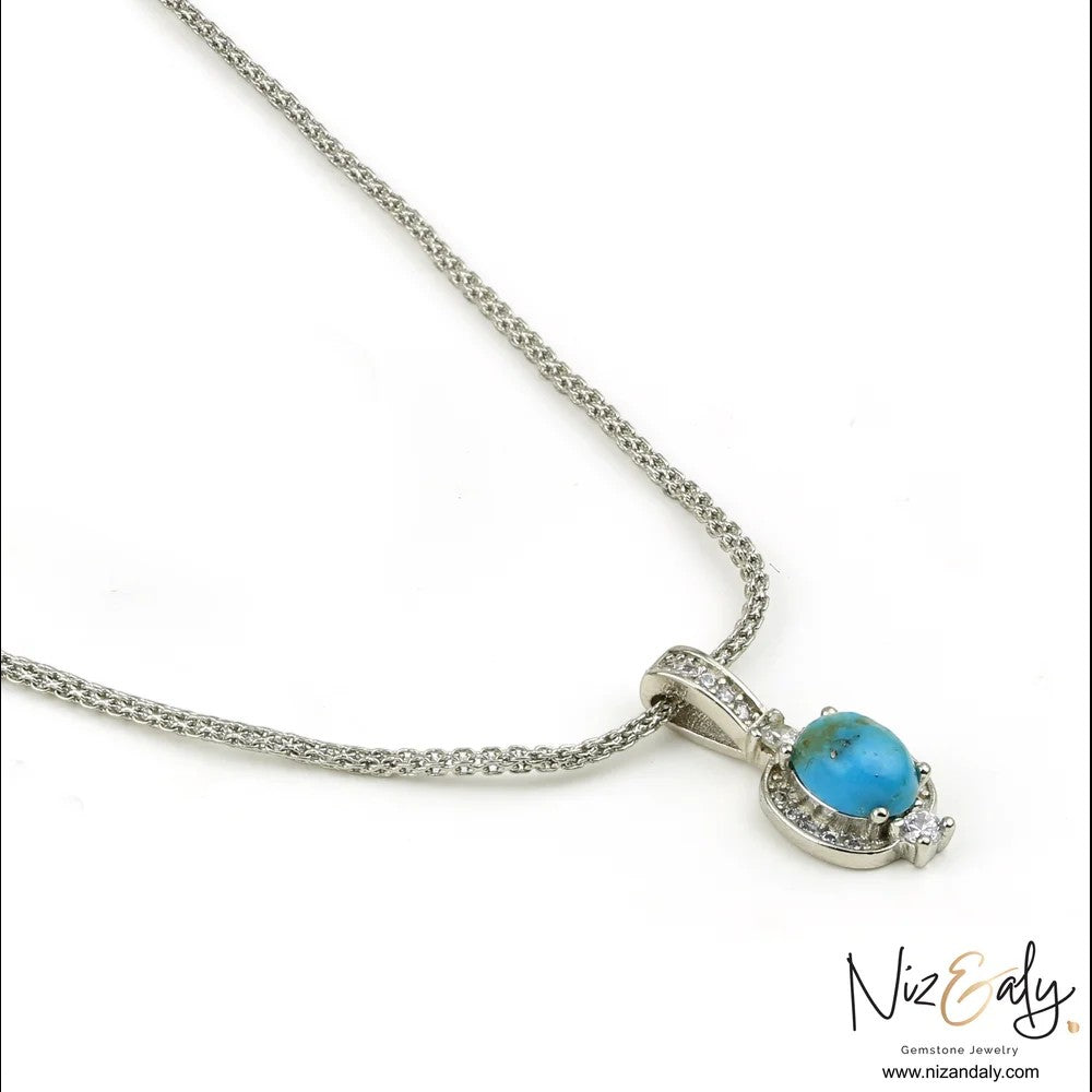 Niz & Aly oval Kingman blue turquoise pendant set in 925 sterling silver with delicate chain on white background