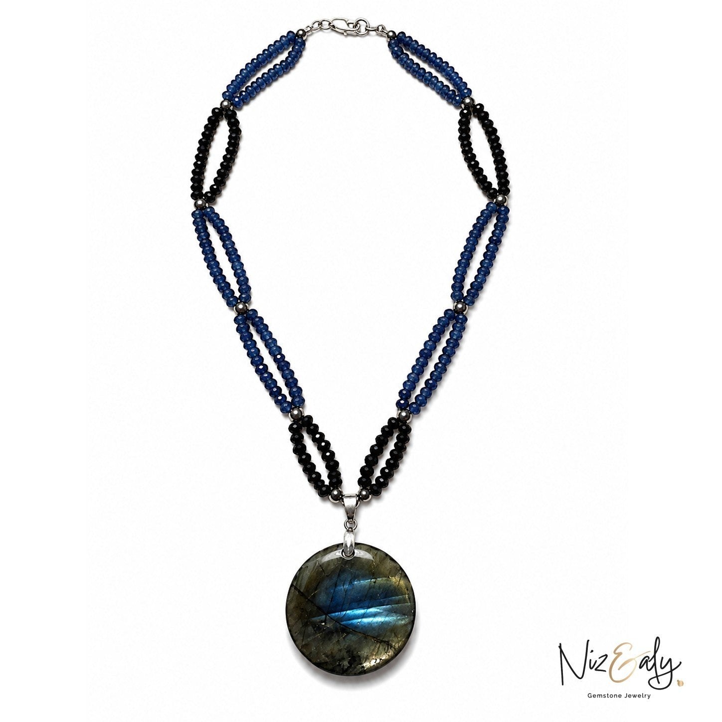 Niz & Aly necklace featuring blue and black gemstone beads with a large round iridescent labradorite pendant