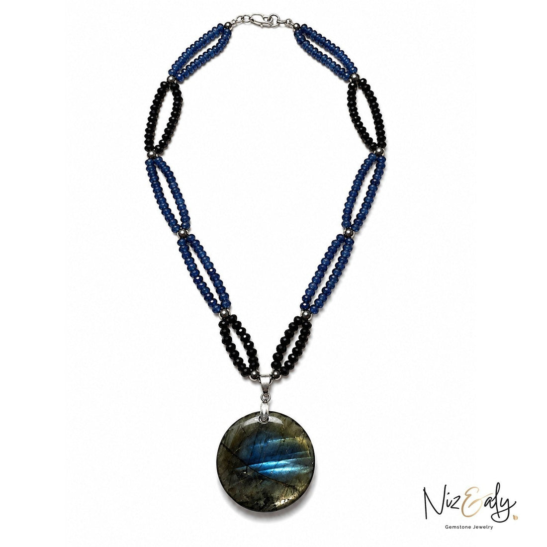 Niz & Aly necklace featuring blue and black gemstone beads with a large round iridescent labradorite pendant