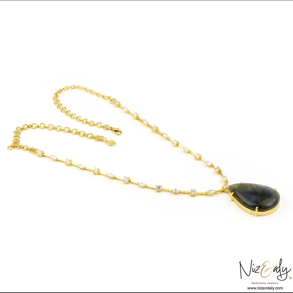 Niz & Aly teardrop labradorite pendant necklace on a gold-toned chain studded with small clear crystals