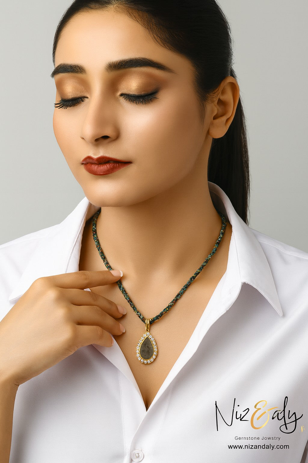 Niz & Aly Twilight Talisman necklace with a labradorite teardrop pendant on micro African turquoise beaded strands.