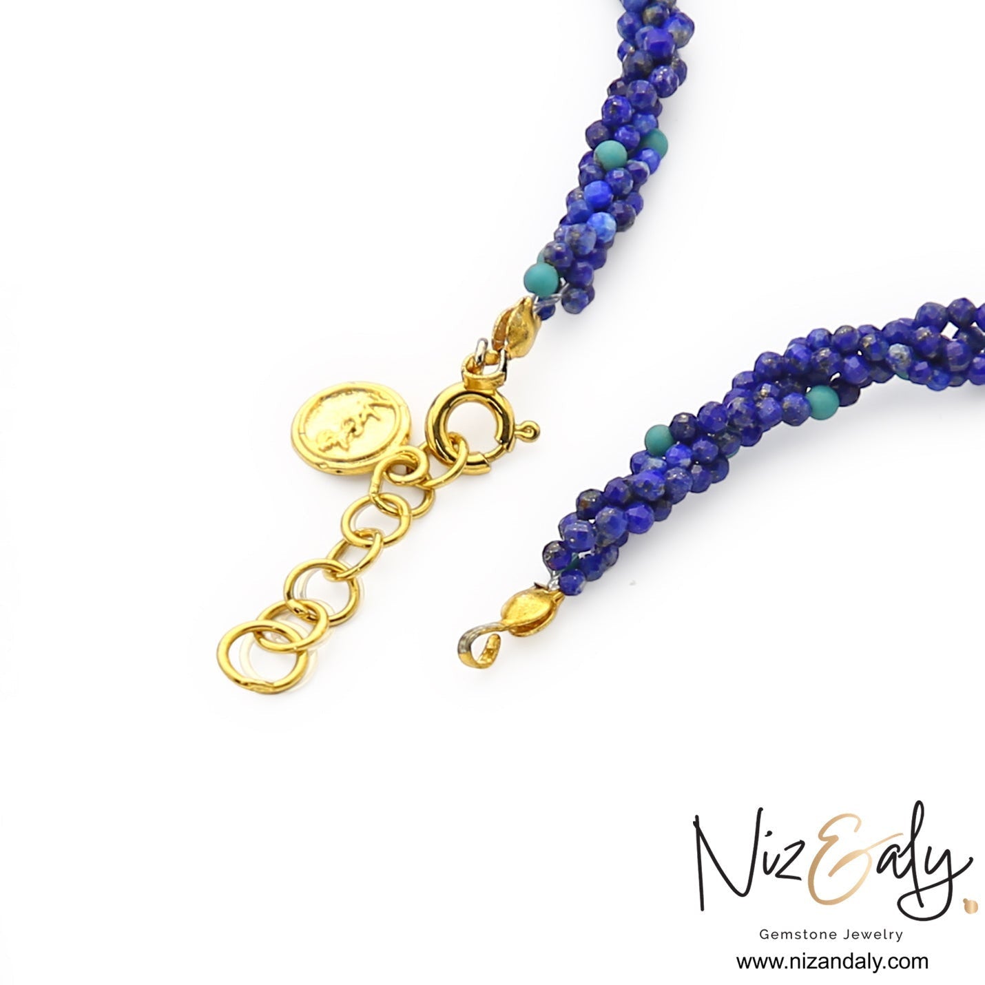 Niz & Aly handcrafted statement necklace featuring micro-beaded royal blue lapis lazuli strands with gold clasp detail.