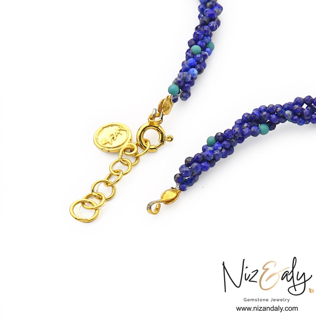 Niz & Aly handcrafted statement necklace featuring micro-beaded royal blue lapis lazuli strands with gold clasp detail.